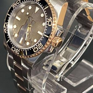 Side angle of the 2 Tone watch on a clear stand