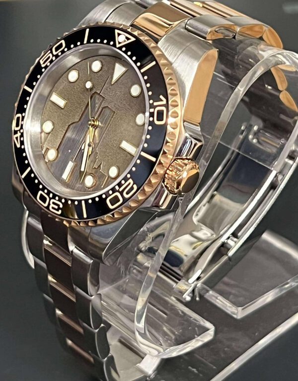 Side angle of the 2 Tone watch on a clear stand