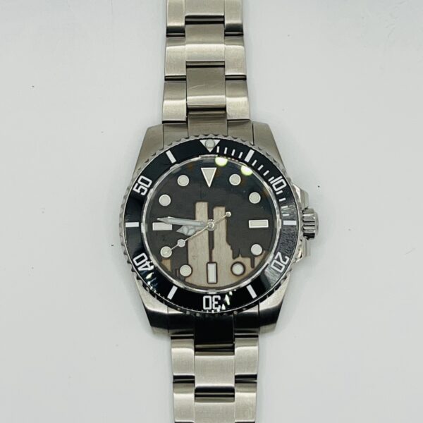 A close up of the Stainless Steel watch face on a white background